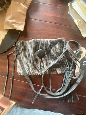 Delila Black and Gray Hair on Hide with tassel crossbody bag.